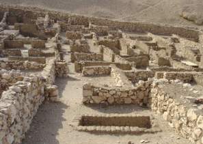 The foundations of the village houses are well preserved and run off both sides of a central street.