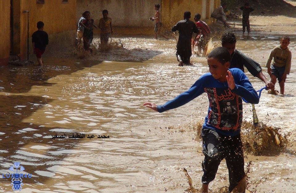 kids play in the flood water
